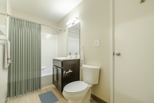 Bathroom With Bathtub and Updated Vanity.