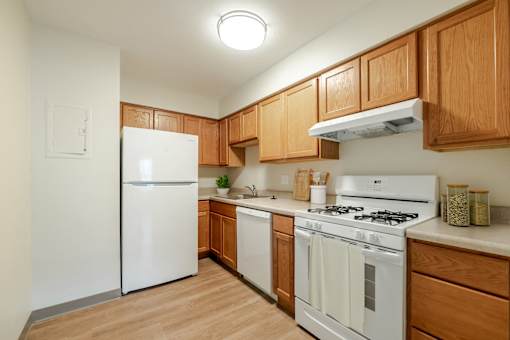 Fully Appliance Kitchen with Wood Cabinets.