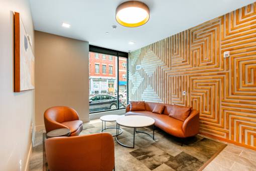 A room with a patterned wall and a couch at Pok Oi Residences, Boston, MA, Massachusetts, 2111