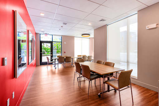 A conference room with a long table and chairs at Pok Oi Residences, Boston, MA, Massachusetts, 2111