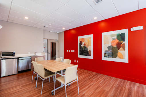 A conference room with a table and chairs