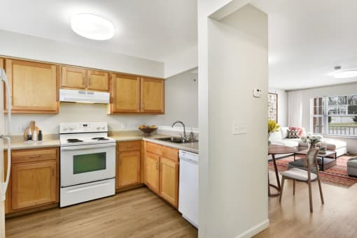 Open Kitchen Layout With View Into Living Room Area at Creekwood Apartments, New York