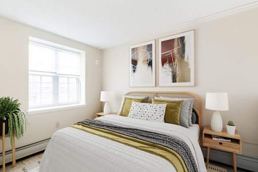 Bedroom With Queen Sized Bed And Large Window  at Lenox Apartments, Boston, 02118