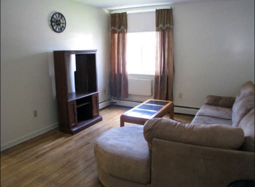 Living room at Coppermine Village Apartments in Bristol, CT