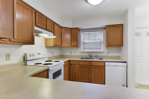 Kitchen Layout with Updated Modern Appliances, Wooden Cabinetry  at Summit Wood Apartments, Watertown, 13601