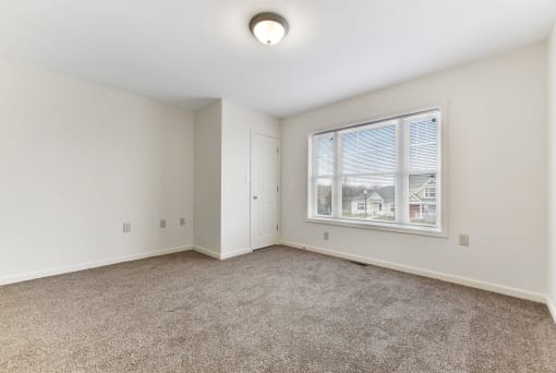 Bedroom Layout With Carpeted Flooring, Large Window  at Summit Wood Apartments, Watertown, 13601