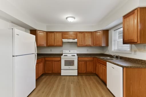 Kitchen Layout with Updated Modern Appliances, Wooden Cabinetry  at Summit Wood Apartments, Watertown, 13601