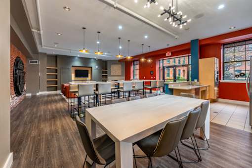 A large conference room with a long table and chairs at The Cordovan at Haverhill Station, Haverhill, MA