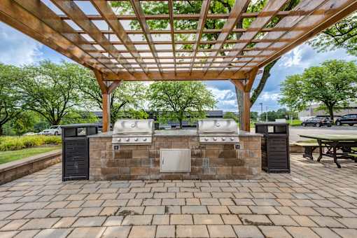 A wooden structure with a roof and a brick wall with a sink under it at Williamsburg Estates, Harrisburg, PA, 17112