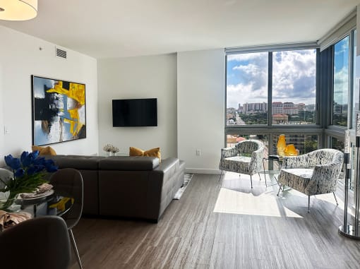 Living room with couch at Douglas Enclave, Miami, FL.