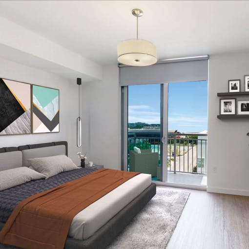 Bedroom with a bed and a sliding glass door at Douglas Enclave located in Miami, FL.
