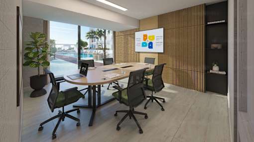 A conference room with a large table and chairs.