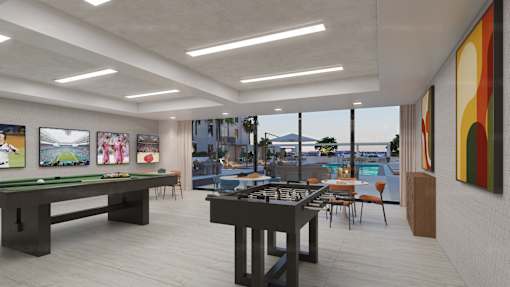 A room with a pool table and a billiard table.