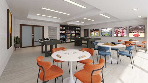 A room with a white table surrounded by orange chairs.