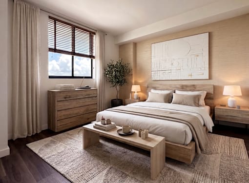 A bedroom with a large bed, a nightstand, and a window with curtains.