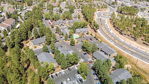 A bird's eye view of a residential area with houses and a road.