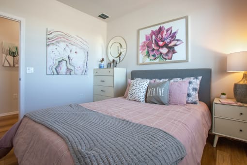 a bedroom with a bed and two night stands