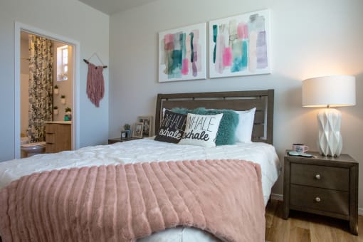 a bedroom with a bed and two night stands