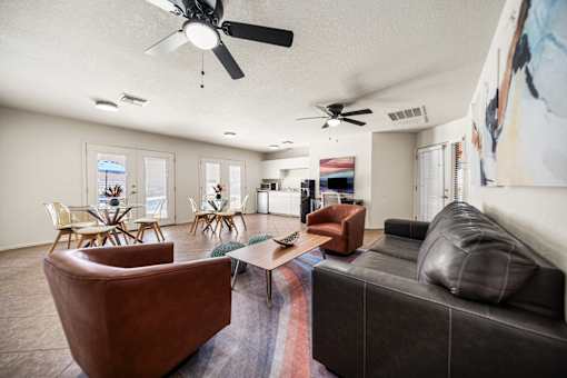 Clubhouse with a couch, and several seating areas.