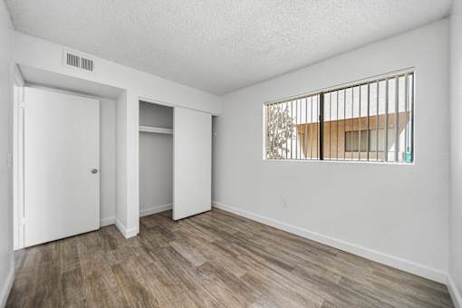 A room with a window and a door.