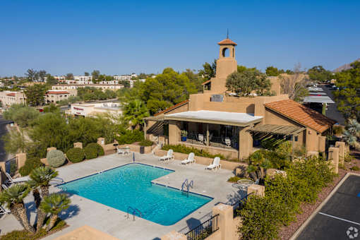 A house with a pool and a tower.
