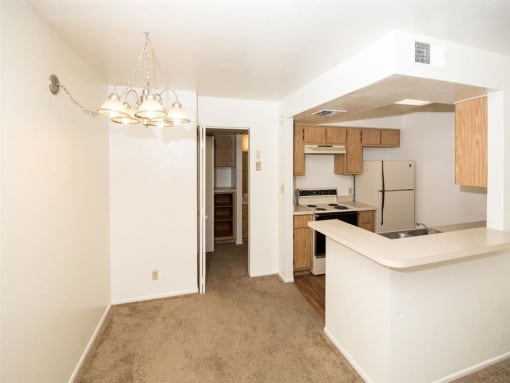 Spacious Kitchen With Pantry Cabinet at University Square Apartments, Flagstaff, Arizona