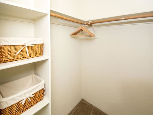 Generous Walk-In Closets With Shelving at Woodlands Village Apartments, Flagstaff
