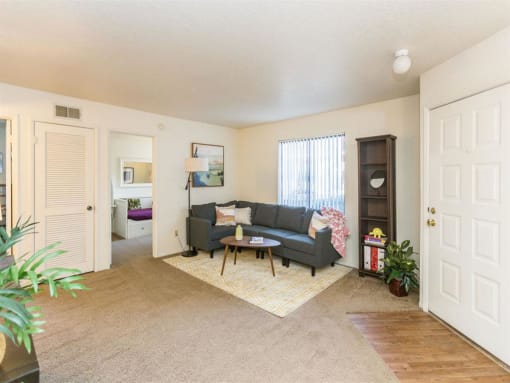 Living Room With Expansive Window at Woodlands Village Apartments, Flagstaff, Arizona