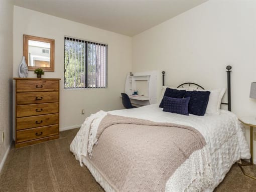Comfortable Bedroom With Large Window at Woodlands Village Apartments, Flagstaff, AZ, 86001