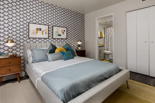 a bedroom with a bed and two night stands