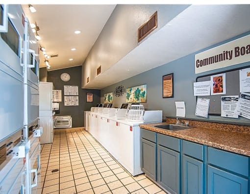 a kitchen with a sink and a refrigerator