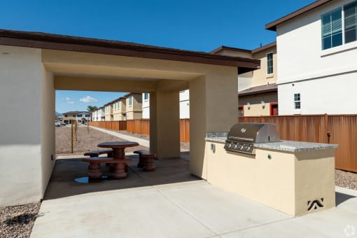 the estates with gas grill and stools