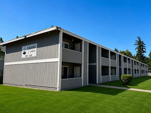 A large building with the sign "Grand" on the front.