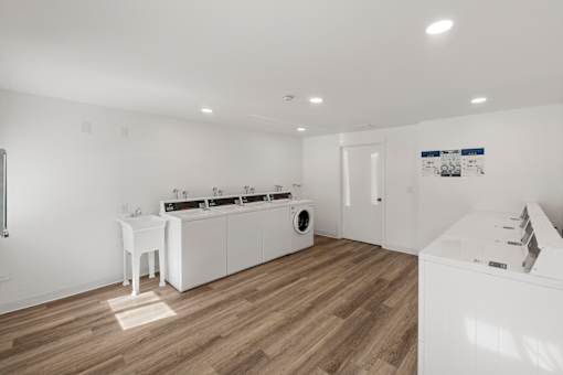 A modern laundry room with a washer and dryer.