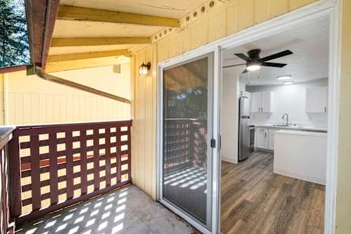 A view of a kitchen from a balcony.