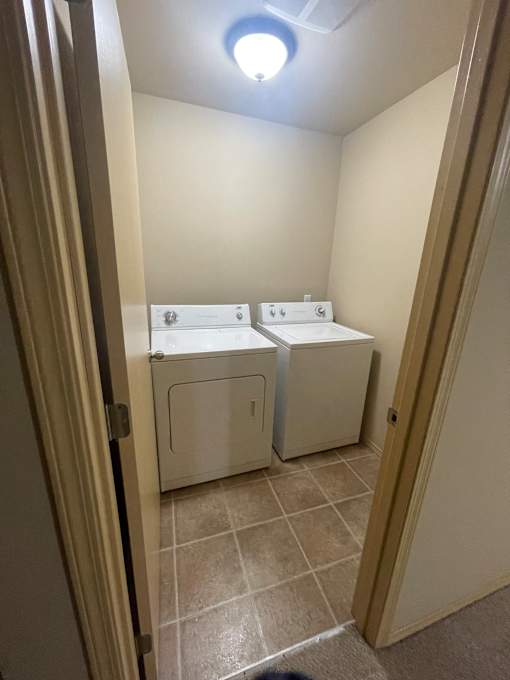 A white appliance is installed in a wall.
