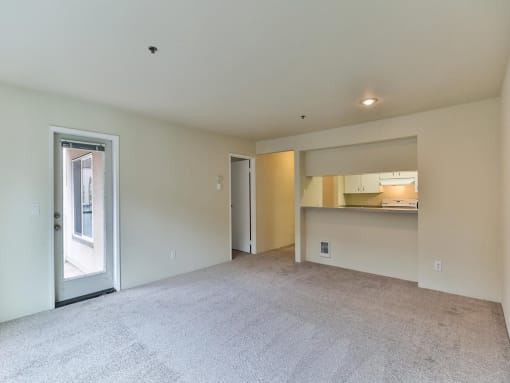 Empty living room  at Charbonneau Apartments in Seattle, WA 98101