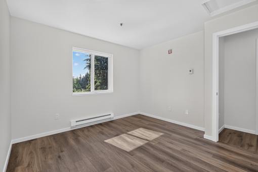 A room with a window and a door.