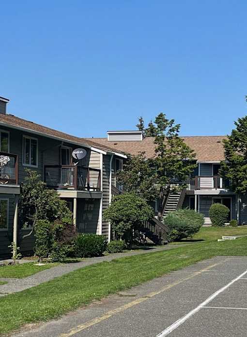 A row of houses with a clear blue sky above them.