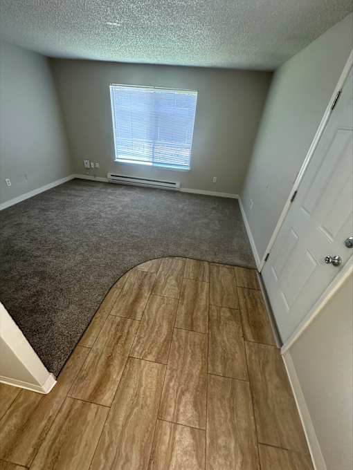 A room with a window and a door.