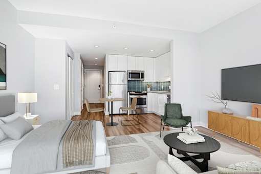 A modern bedroom with a large bed and a television.