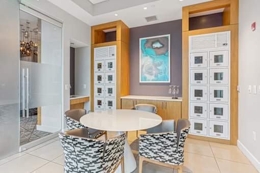 A modern kitchen with a dining table and chairs.