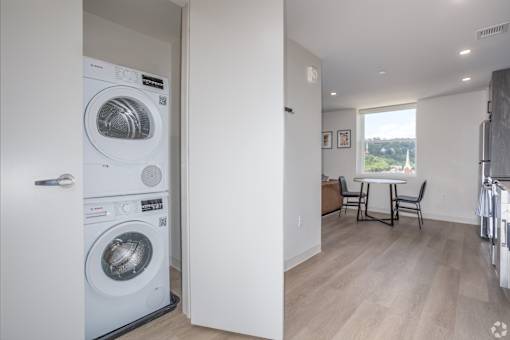 A modern laundry room with a washer and dryer.at The Jones Tower at the Collective, Pittsburgh, PA 15203