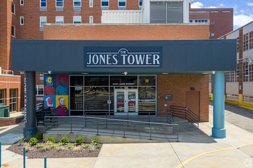 Jones Tower is a building with a blue awning and a mural on the wall.at The Jones Tower at the Collective, Pittsburgh, PA 15203