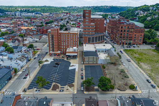 A large building with a parking lot in front of it.at The Jones Tower at the Collective, Pittsburgh, PA 15203