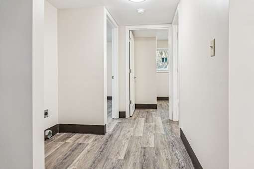 A Hallway With Wood Flooring at Hilldale Apartments, Memphis, TN, 38128