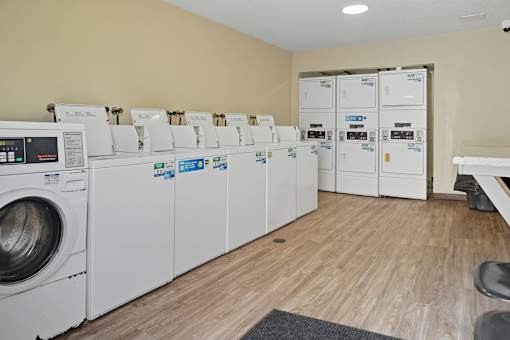 A row of washing machines in a laundromat.