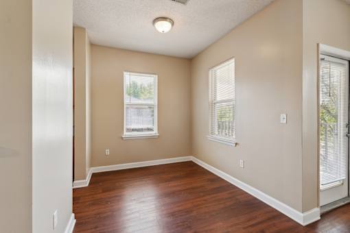 A room with a window and a door.