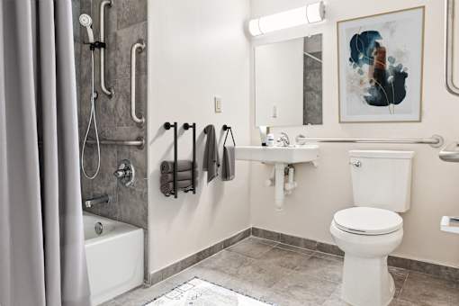 A Bathroom With a White Toilet at Hilldale Apartments, Memphis, TN