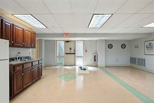 A kitchenette area with tile flooring.